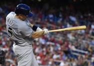 Aug 31, 2018; Washington, DC, USA; Milwaukee Brewers catcher Erik Kratz (15) hits a solo home run against the Washington Nationals during the second inning at Nationals Park. Mandatory Credit: Brad Mills-USA TODAY Sports