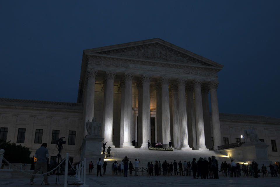 Mourners pay respects as Justice Ruth Bader Ginsburg lies in repose under the Portico at the top of the front steps of the U.S. Supreme Court building on Thursday, Sept. 24, 2020, in Washington. Ginsburg, 87, died of cancer on Sept. 18. (AP Photo/Jose Luis Magana)