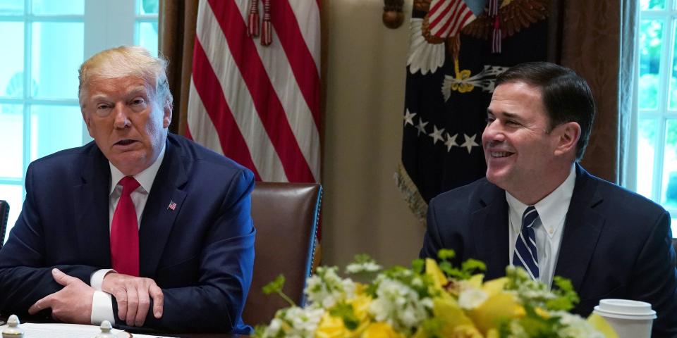 WASHINGTON, DC - JUNE 13: U.S. President Donald Trump (C) speaks as Iowa Gov. Kim Reynolds (L) and Arizona Gov. Doug Ducey (R) listen during a working lunch with governors on “workforce freedom and mobility” at the Cabinet Room of the White House June 13, 2019 in Washington, DC. President Trump spoke about the administration’s work to overhaul occupational licensing laws, job training programs and child care policies at companies around the country.