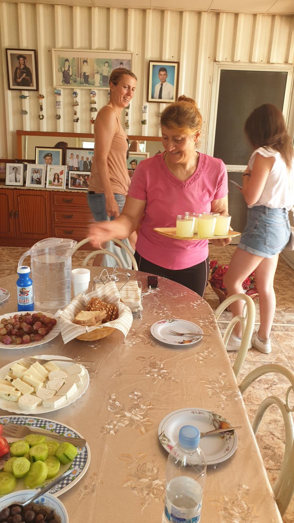 Mrs Loulla serves lunch in the farmhouse (Katie Wright/PA)