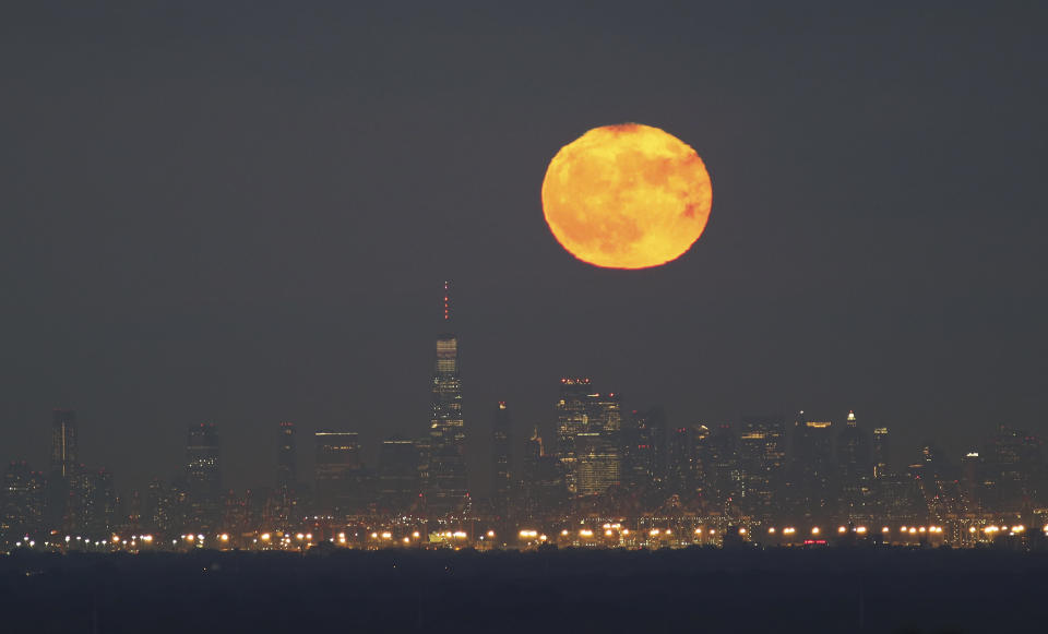 The full blue moon rise behind One World Trade Center in New York City on Halloween on October 31, 2020. (Photo by: Getty) 