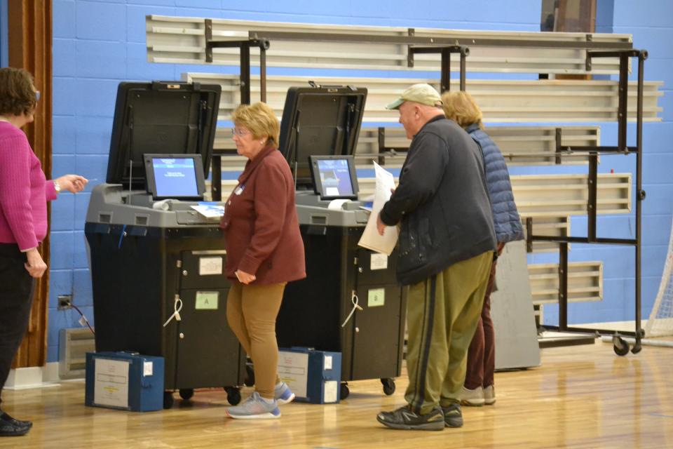 What had been a slow day at the polls turned into a mini-rush Tuesday morning as a trio of voters cast their ballots at Gaudet Middle School in Middletown.