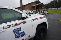 A heavy Louisiana State Police presence is seen at the New Chapel Hill Baptist Church during funeral services for Master Trooper Chris Hollingsworth, Friday, Sept. 25, 2020, in West Monroe, La. Hollingsworth, killed in a car crash hours after he was told he would be fired for his role in the death of a Black man, was buried with honors Friday at a ceremony that authorities sought to keep secret out of concerns it would attract a mass protest. (AP Photo/Rogelio V. Solis)
