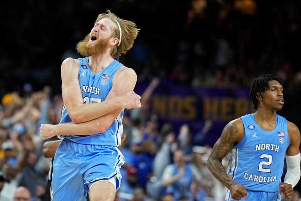 North Carolina forward Brady Manek celebrates after scoring against Kansas during the first half of a college basketball game in the finals of the Men's Final Four NCAA tournament, Monday, April 4, 2022, in New Orleans. (AP Photo/Brynn Anderson)