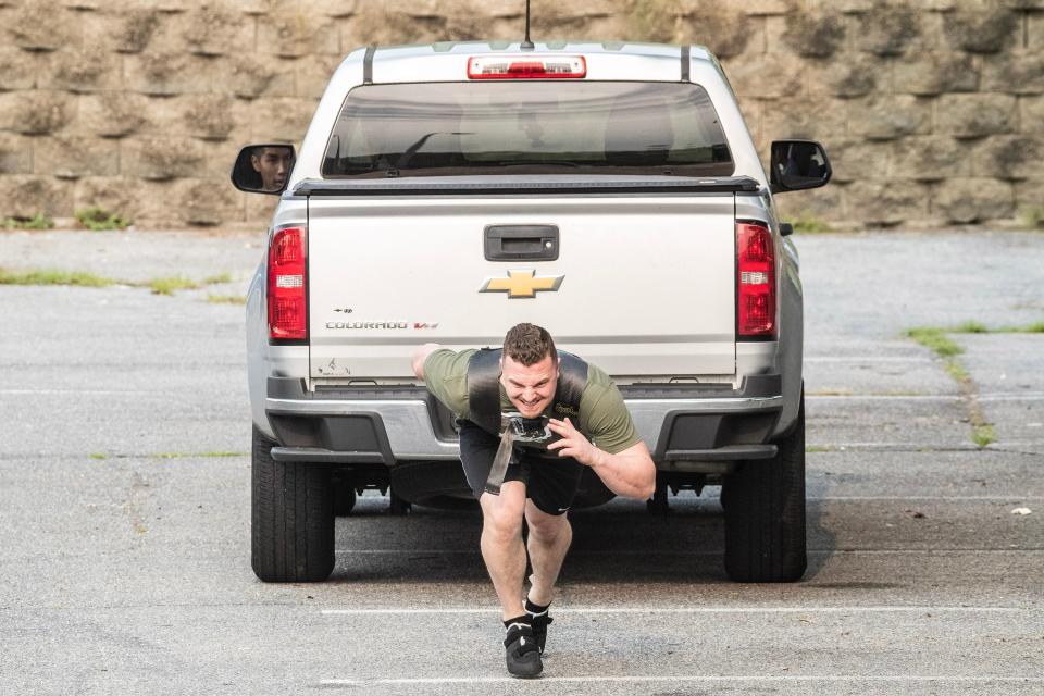 Bradie Crandall pulls a Chevy Colorado truck at the Training Center near New Castle on Thursday, Aug. 3, 2023. Crandall, a chemical engineering doctoral candidate at the University of Delaware, is among the nation's top powerlifters and a vegan.