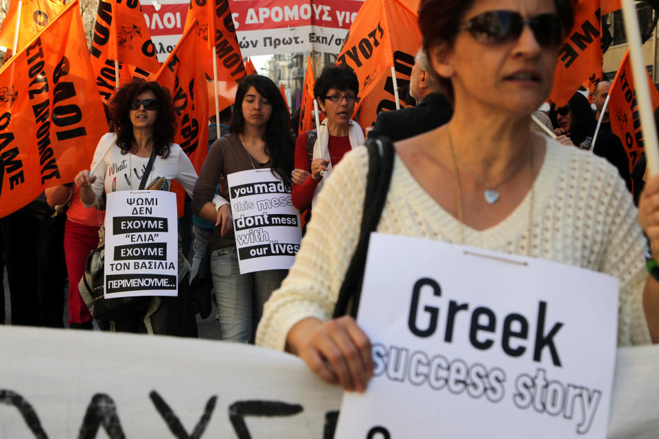 Protesters chant anti- austerity slogans during a rally in the northern Greek port city of Thessaloniki, on Wednesday, March 19, 2014. Greek civil servants, including hospital and teaching staff, have started a two-day strike against austerity measures imposed under the debt-mired country's international bailout commitment. (AP Photo/Nikolas Giakoumidis)