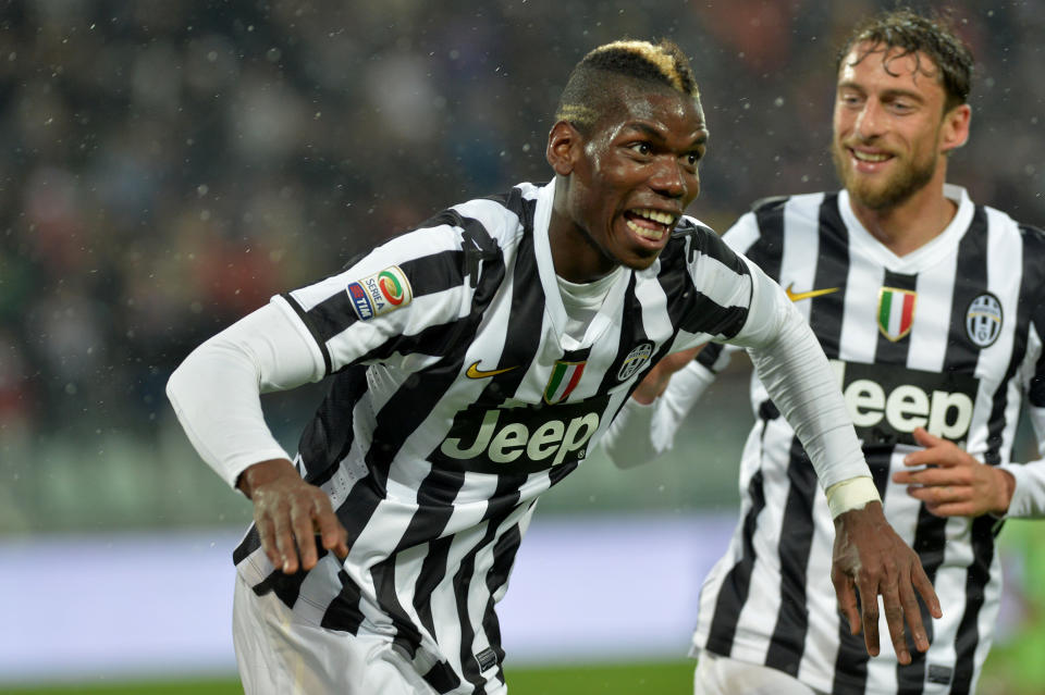 Juventus midfielder Paul Pogba, of France, celebrates after scoring during a Serie A soccer match between Juventus and Bologna at the Juventus stadium, in Turin, Italy, Saturday, April 19, 2014. (AP Photo/Massimo Pinca)