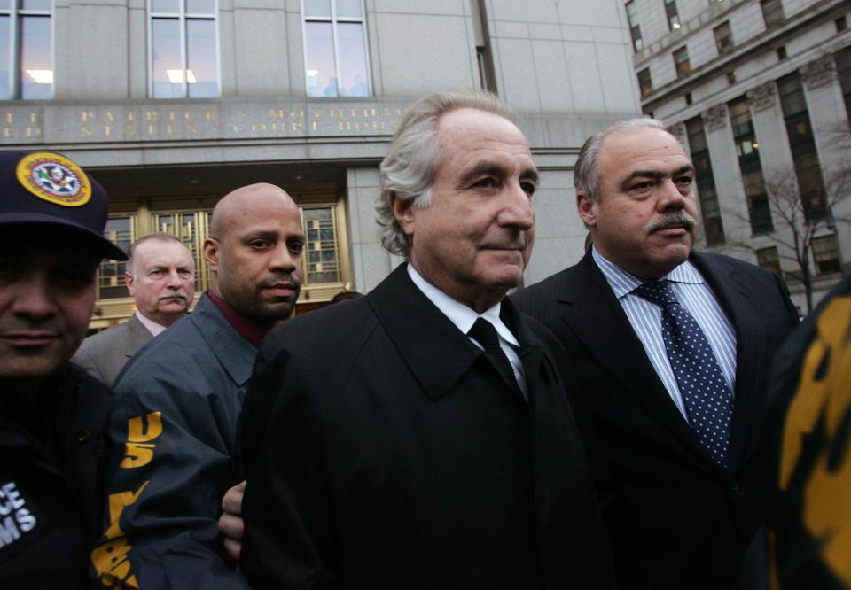 NEW YORK - JANUARY 5:  Bernard Madoff (C) walks out from Federal Court after a bail hearing in Manhattan January 5, 2009 in New York City. Madoff is accused of running a $50 billion Ponzi scheme through his investment company. Madoff is free on bail and hasn�t formally responded to the charges or entered a plea.  (Photo by Hiroko Masuike/Getty Images)
