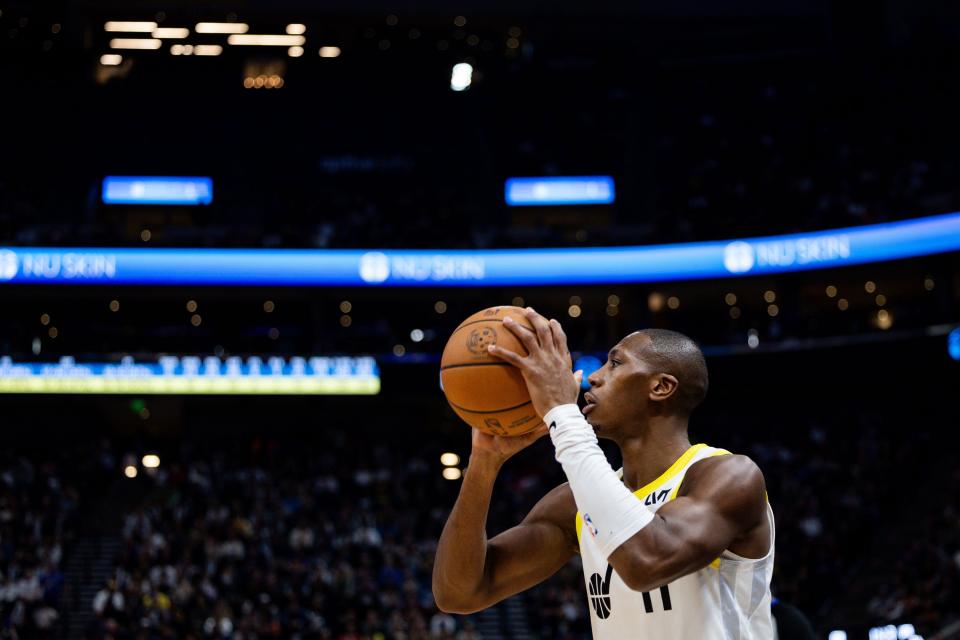 Utah Jazz guard <a class="link " href="https://sports.yahoo.com/nba/players/5636/" data-i13n="sec:content-canvas;subsec:anchor_text;elm:context_link" data-ylk="slk:Kris Dunn;sec:content-canvas;subsec:anchor_text;elm:context_link;itc:0">Kris Dunn</a> (11) shoots a 3-point basket during the NBA basketball game between the Utah Jazz and the Golden State Warriors at the Delta Center in Salt Lake City on Thursday, Feb. 15, 2024. | Megan Nielsen, Deseret News