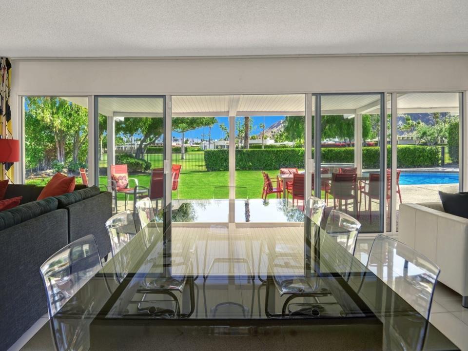 the dining area in Disney's Palm Springs home, which looks out onto the lawn