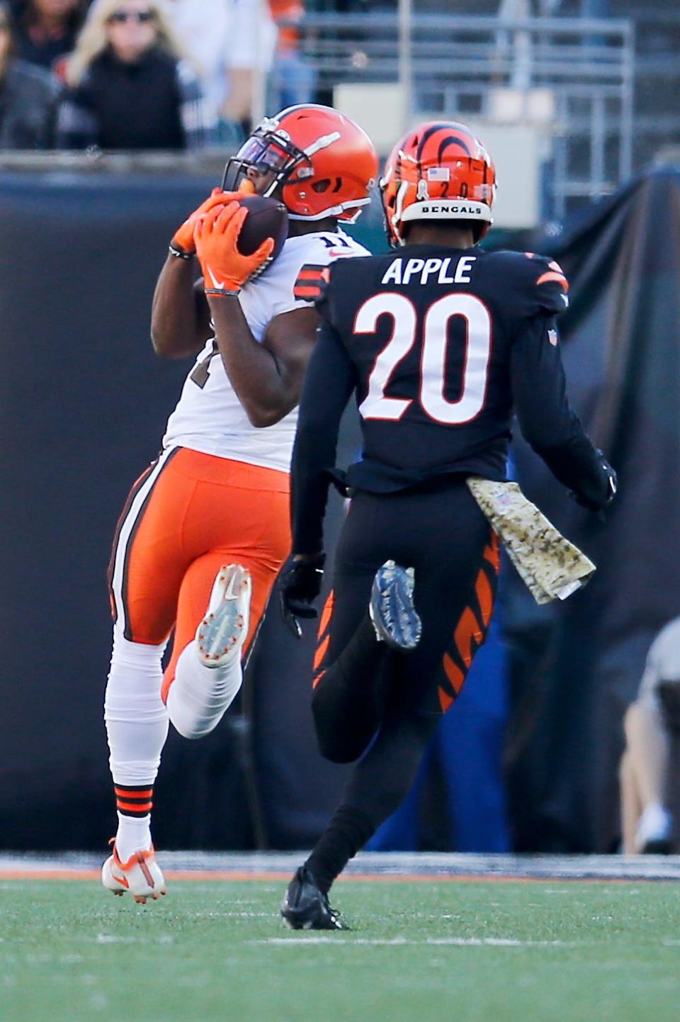 Cleveland Browns wide receiver Donovan Peoples-Jones (11) catches a deep pass over Cincinnati Bengals cornerback Eli Apple (20) for a touchdown in the second quarter of the NFL Week 9 game between the Cincinnati Bengals and the Cleveland Browns at Paul Brown Stadium in Cincinnati on Sunday, Nov. 7, 2021. Cleveland led 24-10 at halftime. 