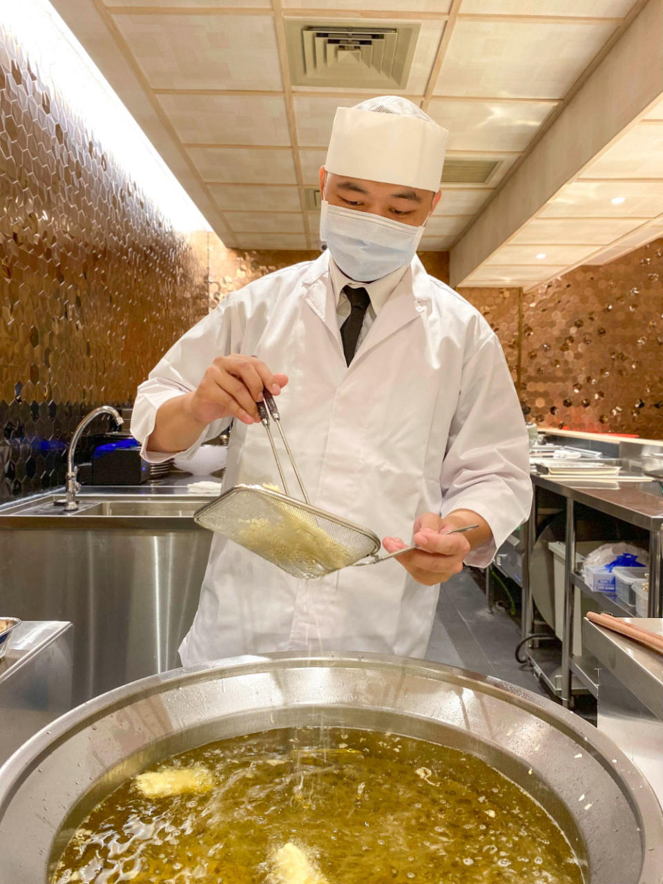 a chef making tempura