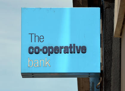 File photo dated 07/08/13 of a Co-operative Bank branch sign as the bank has launched a new fight to win back customers and re-build its ethical reputation with a ?125 current account switching offer which includes a donation to charity. PRESS ASSOCIATION Photo. Issue date: Tuesday February 4, 2014. Customers who switch their current account to the Co-op will get ?100 and they will also be able to donate a further ?25 to one of seven charities, including Action Aid, Oxfam, Water Aid and Amnesty International. See PA story MONEY Coop. Photo credit should read: John Stillwell/PA Wire