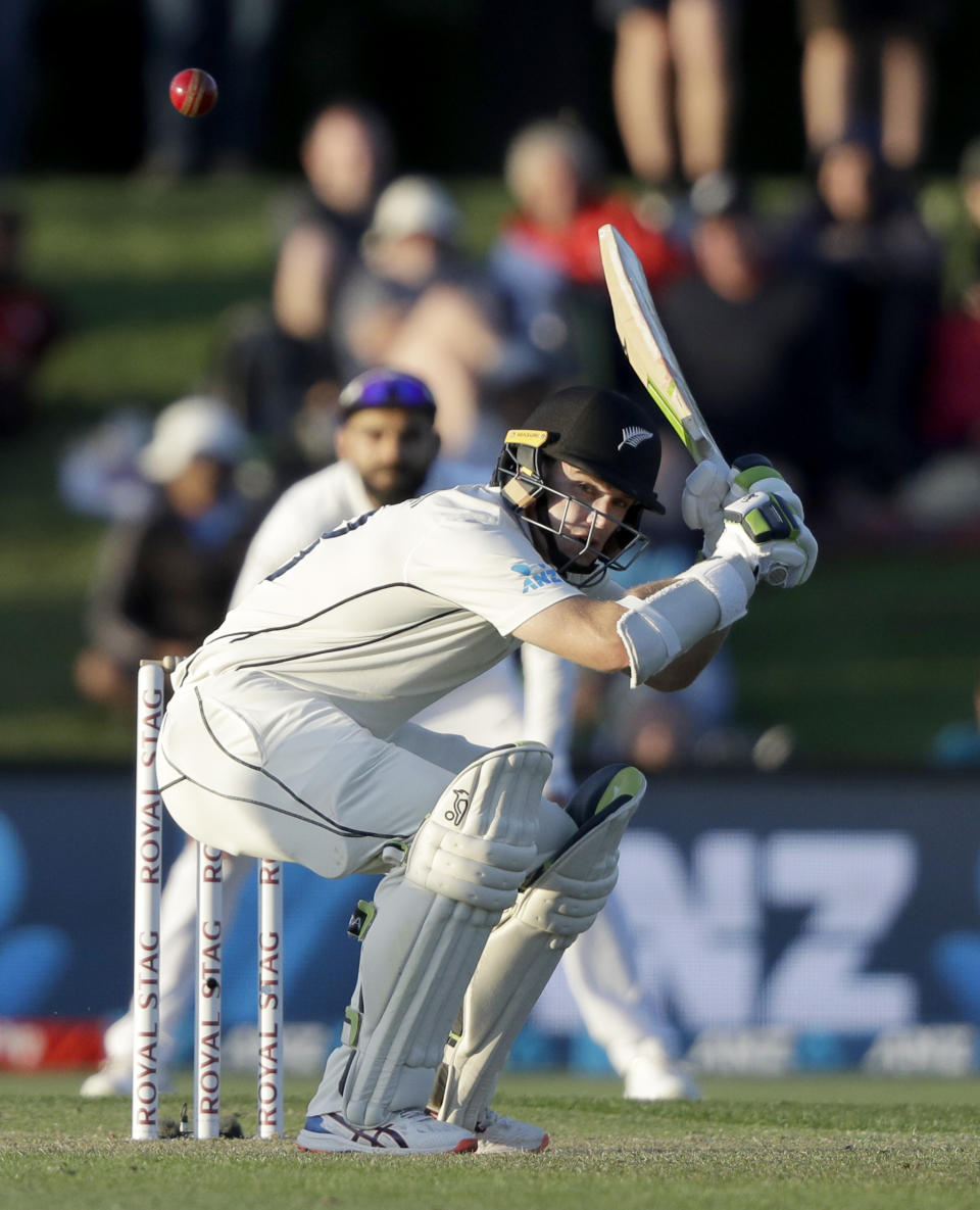 New Zealand's Tom Latham ducks to avoid a bouncer while batting during play on day one of the second cricket test between New Zealand and India at Hagley Oval in Christchurch, New Zealand, Saturday, Feb. 29, 2020. (AP Photo/Mark Baker)