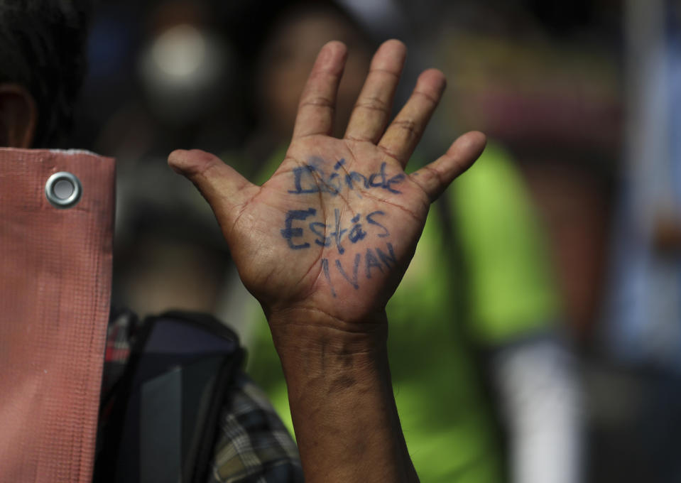 A person's his hand reads in Spanish "Where are you Ivan?" during a march in remembrance of those who have disappeared, on Mother's Day in Mexico City, Monday, May 10, 2021. (AP Photo/Fernando Llano)