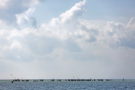 People take part in the annual event called the Herring March in Puck Bay