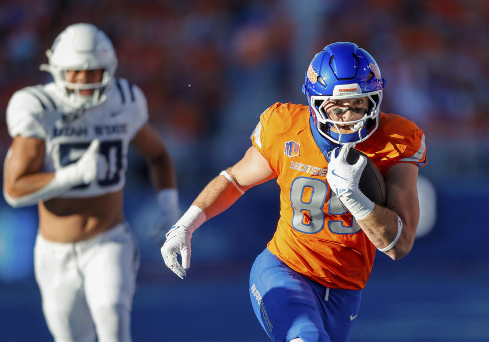 Boise State tight end Matt Lauter (85) runs with the ball after a reception against Utah State in the first half of an NCAA college football game, Saturday, Oct. 5, 2024, in Boise, Idaho. . (AP Photo/Steve Conner)