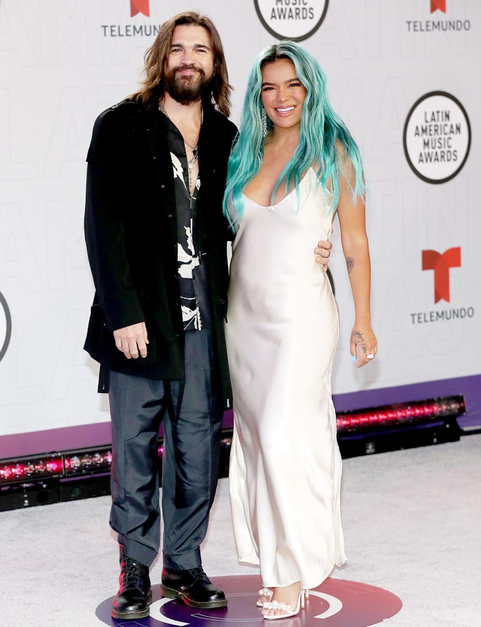 <p>Juanes and Karol G step out onto the red carpet for the Latin American Music Awards on Thursday in Sunrise, Florida. </p>
