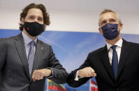 NATO Secretary General Jens Stoltenberg greets Canada's Prime Minister Justin Trudeau during a bilateral meeting on the sidelines of a NATO summit at NATO headquarters in Brussels, Monday, June 14, 2021. U.S. President Joe Biden is taking part in his first NATO summit, where the 30-nation alliance hopes to reaffirm its unity and discuss increasingly tense relations with China and Russia, as the organization pulls its troops out after 18 years in Afghanistan. (Stephanie Lecocq, Pool via AP)