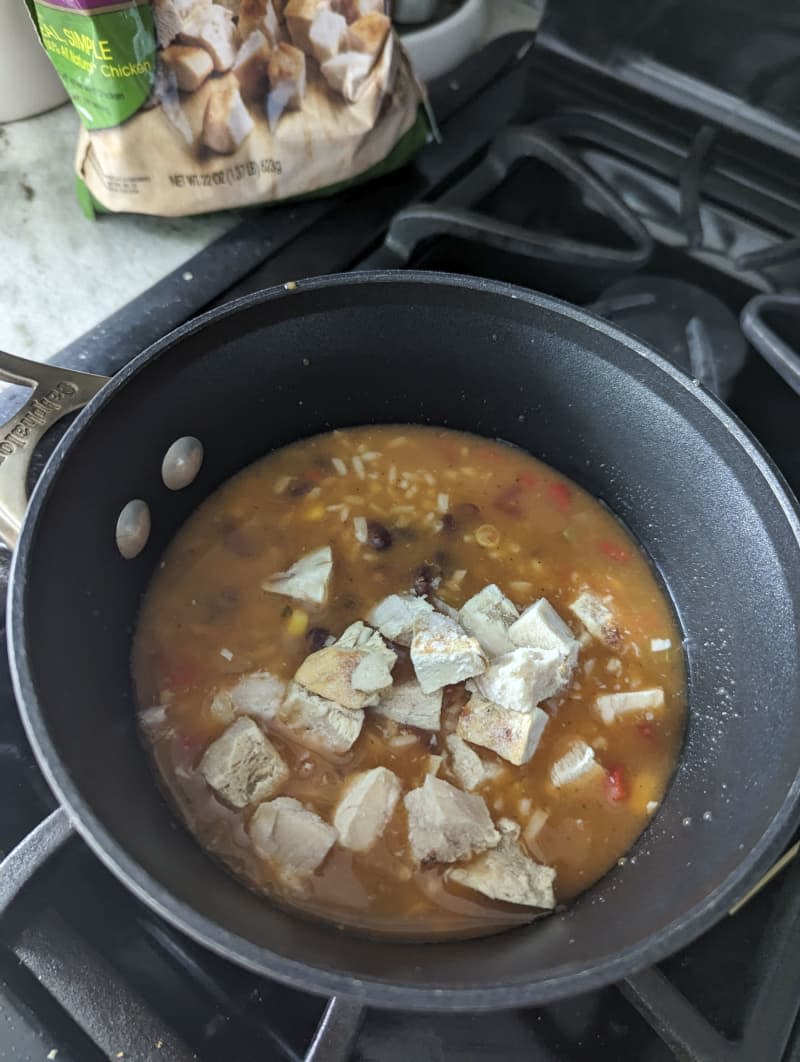 Tyson grilled and ready chicken in a pot with soup.