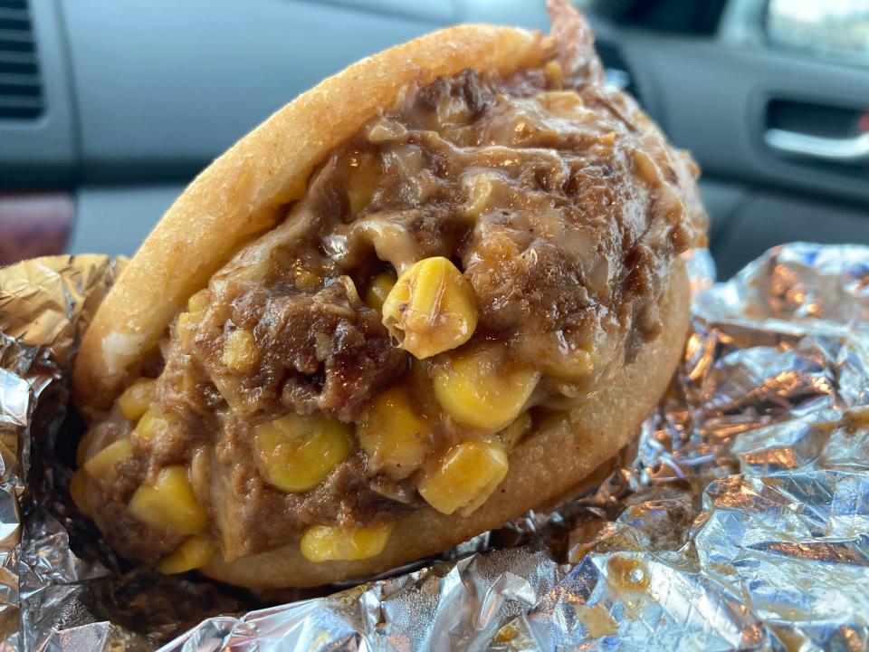 The Colombianita arepa from Arepiz is photographed inside a car in a parking lot behind the Saraga international food festival at 8448 Center Run Dr in Castleton on Sunday, Sept. 17.