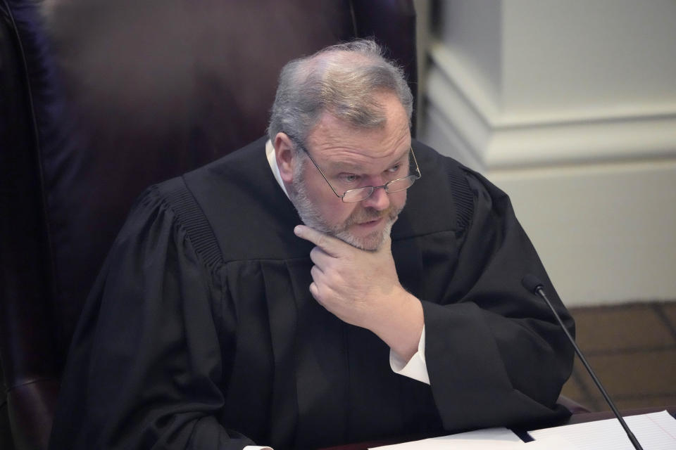 Associate Justice David Ishee of the Mississippi Supreme Court, listens as attorneys present their arguments over a state law that would put $10 million of federal pandemic relief money into infrastructure grants for private schools, Tuesday, Feb. 6, 2024, in Jackson, Miss. (AP Photo/Rogelio V. Solis)