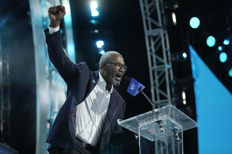 Former players Muhsin Muhammed announces a pick for the Carolina Panthers during the second round of the NFL football draft, Friday, April 26, 2024, in Detroit. (AP Photo/Jeff Roberson)