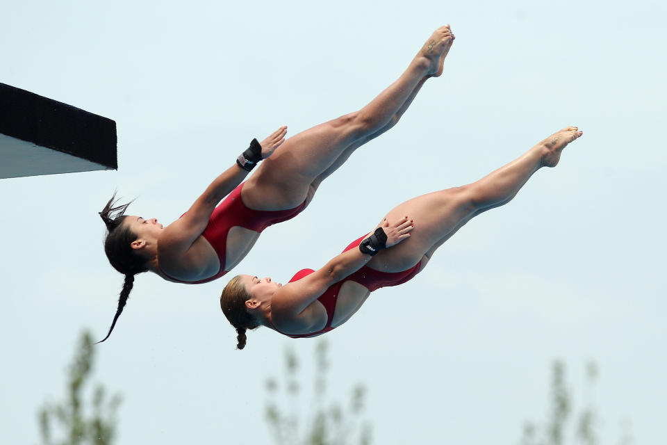 SHANGHAI, CHINA - JULY 18: Meaghan Benfeito and Roseline Filion of Canada compete in the Women's 10m Platform Synchro preliminary round during Day Three of the 14th FINA World Championships at the Oriental Sports Center on July 18, 2011 in Shanghai, China. (Photo by Zhang Lintao/Getty Images)