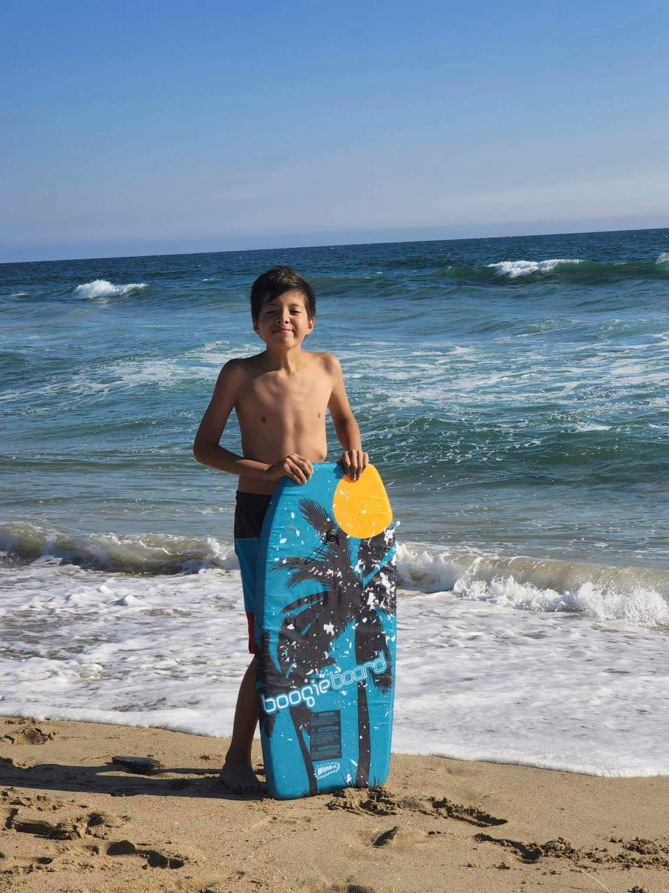 Honor Beauvais, 12- year-old, visits Huntington Beach in Southern California, in August 2022. Honor loved his annual vacation to the California beaches. Beauvais died last month as a snow battered the Rosebud Sioux Reservation in South Dakota after an ambulance couldn’t get to him in time. He was asthmatic and had influenza. (Cordier Beauvais via AP)