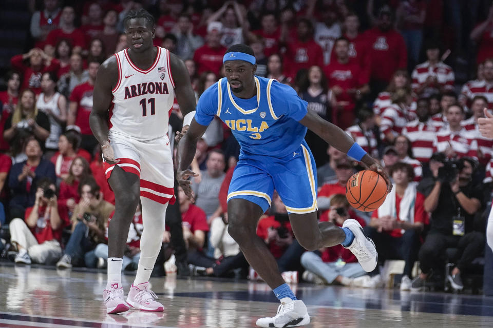 UCLA's Adem Bona (3) starts a fast break after stealing the ball from Arizona's Oumar Ballo (11) during the first half of an NCAA college basketball game Saturday, Jan. 20, 2024, in Tucson, Ariz. (AP Photo/Darryl Webb)