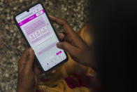A woman learns to use a chatbot powered by artificial intelligence developed by Myna Mahila Foundation at the local women's organization’s office in Mumbai, India, Feb. 1, 2024. The chatbot, currently a pilot project, represents what many hope will be part of the impact of AI on health care around the globe: to deliver accurate medical information in personalized responses that can reach many more people than in-person clinics or trained medical workers. (AP Photo/Rafiq Maqbool)