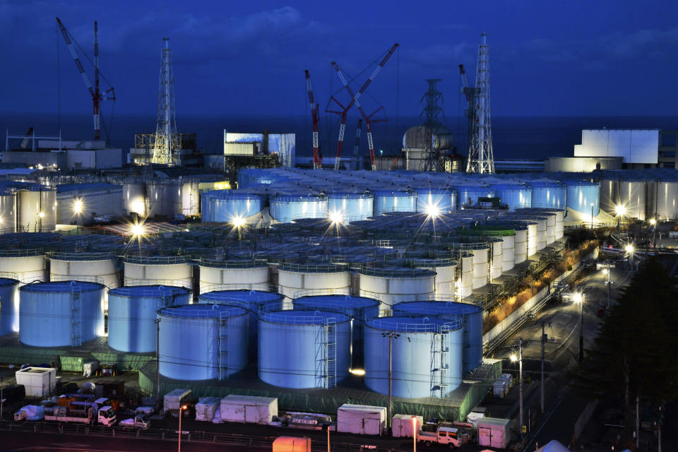 This Jan. 25, 2019, photo shows water tanks containing contaminated water that has been treated at the Fukushima Dai-ichi nuclear plant in Okuma town, Fukushima prefecture, northeastern Japan. The utility company operating Fukushima's tsunami-wrecked nuclear power plant said Friday, Aug. 9, 2019 it will run out of space for tanks to store massive amounts of treated but still contaminated water in three years, adding pressure for the government and the public to reach consensus on what to do with the water. (Kyodo News via AP)