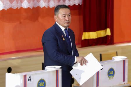 Presidential candidate Khaltmaa Battulga holds his ballot paper in a polling station in Ulaanbaatar, Mongolia, June 26, 2017. REUTERS/B. Rentsendorj