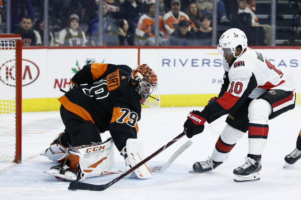 Ottawa Senators' Anthony Duclair, right, cannot score a goal past Philadelphia Flyers' Carter Hart during the third period of an NHL hockey game, Saturday, Dec. 7, 2019, in Philadelphia. (AP Photo/Matt Slocum)