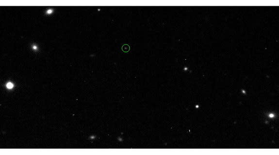 This image is one of three discovery images of 2011 QF99 taken from Canada-France-Hawaii Telescope on Oct. 24, 2011 (2011 QF99 is inside the green circle). 2011 QF99 is the first Trojan asteroid discovered around Uranus. Image released Aug. 29,