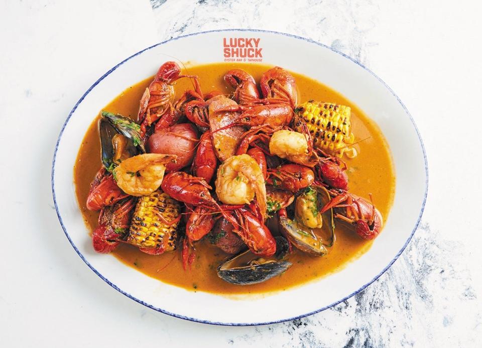 The crawfish boil platter is a Mardi Gras special at Lucky Shuck, a waterfront seafood restaurant on the Jupiter Inlet.