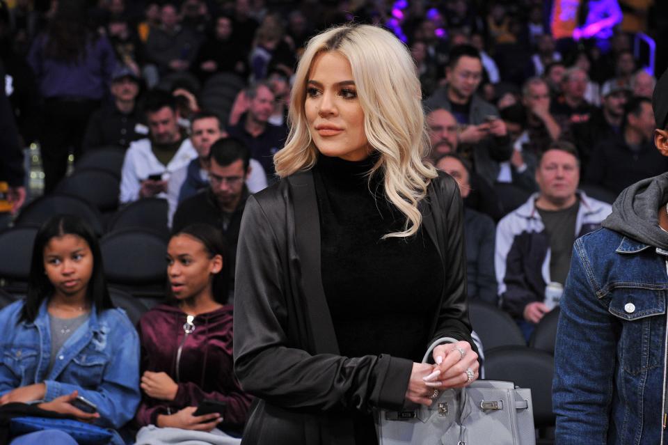 Khloe Kardashian is photographed at a sports game