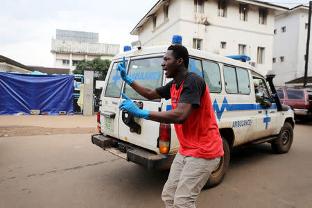 A man directs ambulances on arrival at the entrance of the Connaught Hospital in Freetown, Sierra Leone August 16, 2017. REUTERS/Afolabi Sotunde