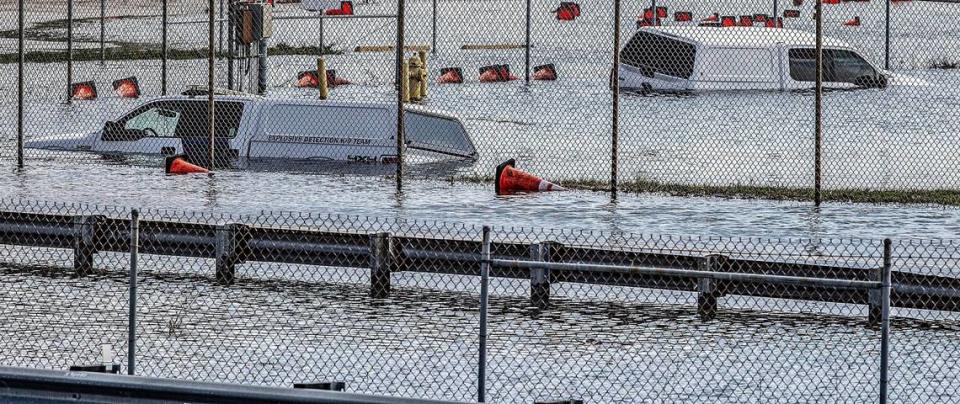 Two partially submerged vehicles from the explosives detection K9 team that got flooded at Fort Lauderdale-Hollywood International Airport, Thursday April 13, 2023.