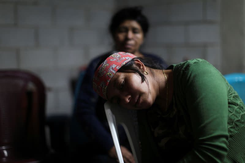 Family and friends gather to mourn the dead of their loved ones who died in the U.S., in Nahuala