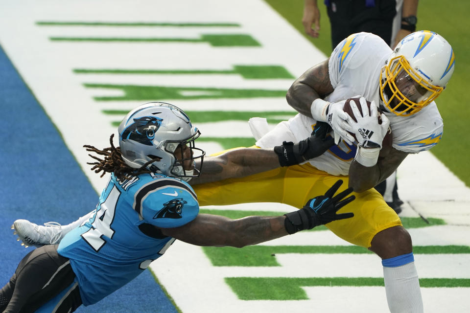 Los Angeles Chargers wide receiver Keenan Allen, right, makes a touchdown catch next to Carolina Panthers outside linebacker Shaq Thompson during the second half of an NFL football game Sunday, Sept. 27, 2020, in Inglewood, Calif. (AP Photo/Alex Gallardo)