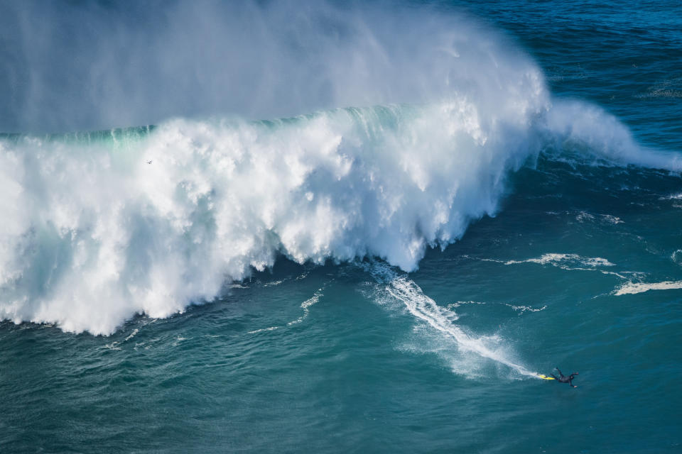 NAZARE, PORTUGAL - 2020/10/29: Big wave surfer Nic Von Rupp from Portugal rides a wave during a tow surfing session at Praia do Norte on the first big swell of winter season. (Photo by Henrique Casinhas/SOPA Images/LightRocket via Getty Images)