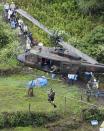 <p>A resident is airlifted for safety after a group of people are stranded in the Ono district following a huge landslide caused by heavy rain in Hita, Oita prefecture, southwestern Japan, Thursday, July 6, 2017. Troops worked Thursday to rescue hundreds of people stranded by flooding in southern Japan. (Photo: Nozomu Endo/Kyodo News via AP) </p>