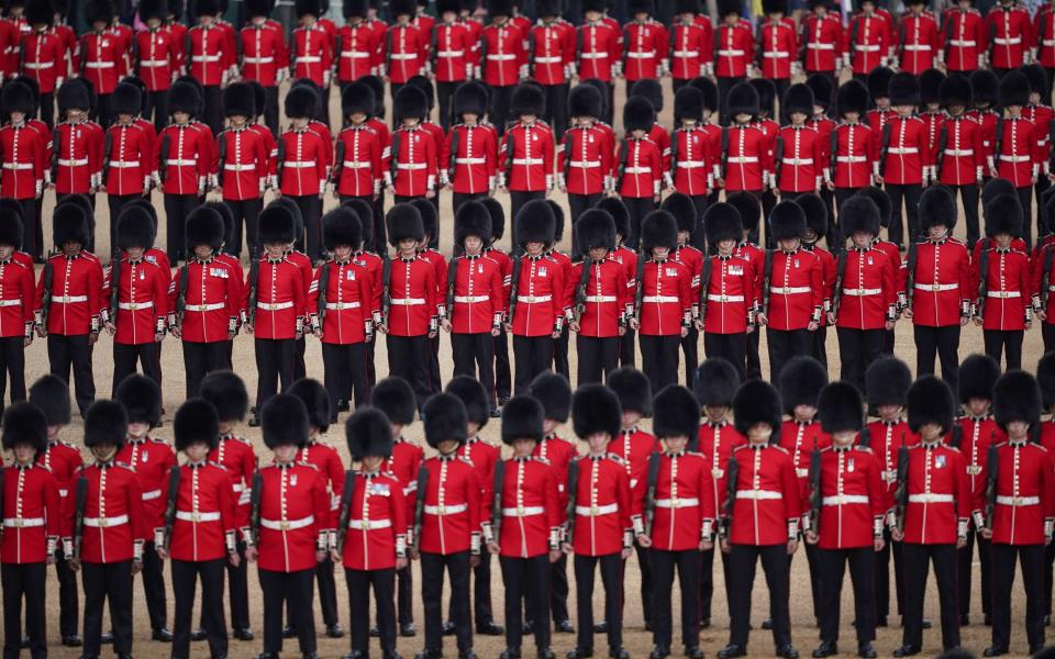 Soldiers parade during the Colonel's Review, the final rehearsal of the Trooping the Colour - Yui Mok 