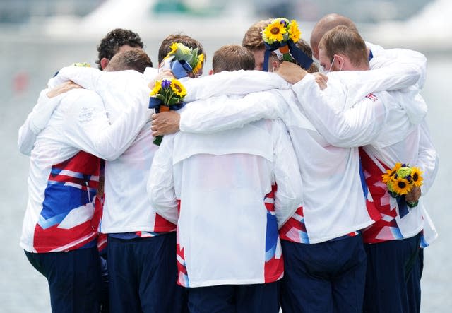 Great Britain men's eight celebrate on the podium 