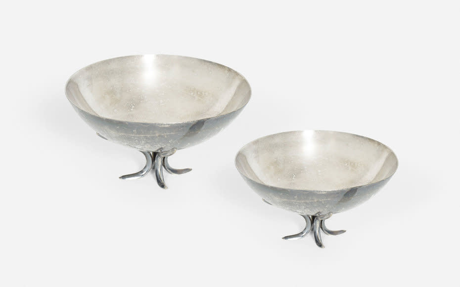 <p>These silver-soldered, footed <a rel="nofollow noopener" href="https://www.wright20.com/auctions/2016/07/the-four-seasons/272" target="_blank" data-ylk="slk:bread baskets;elm:context_link;itc:0;sec:content-canvas" class="link ">bread baskets</a>, by Garth and Ada Louise Huxtable, are estimated to bring in between $1,000 and $1,500.</p>