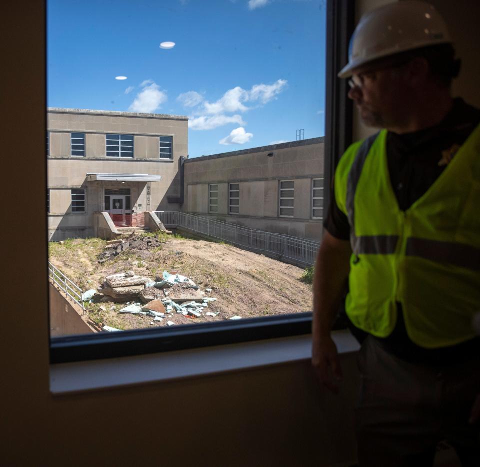 Wood County Sheriff Shawn Becker looks out onto the area that will hold underground parking for designated officials once construction is finished at the Wood County Sheriff's Office and Jail in Wisconsin Rapids.