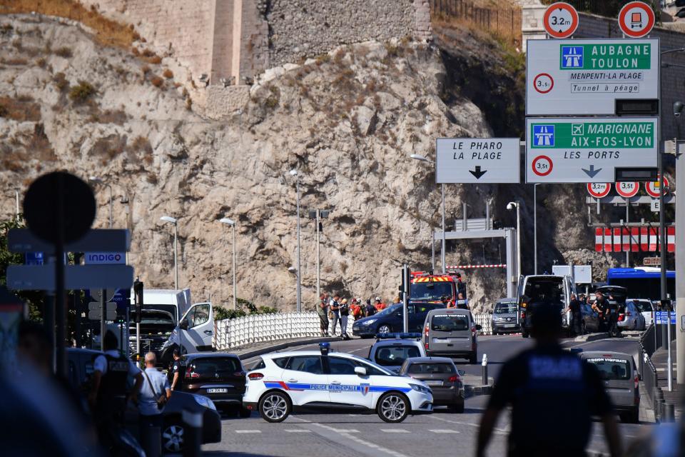 <p>French forensic police officers and security personnel gather near a vehicle following a car crash in the southern Mediterranean city of Marseille on Aug. 21, 2017. (Photo: Bertrand Langlois/AFP/Getty Images) </p>