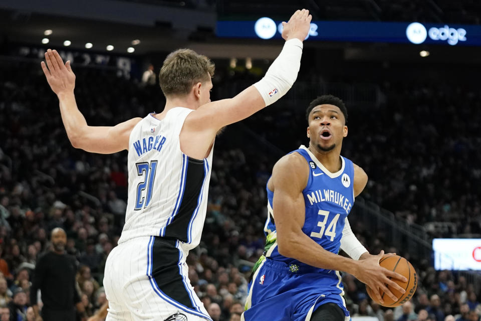 Milwaukee Bucks' Giannis Antetokounmpo (34) drives against Orlando Magic's Moritz Wagner during the second half of an NBA basketball game Wednesday, March 1, 2023, in Milwaukee. (AP Photo/Aaron Gash)