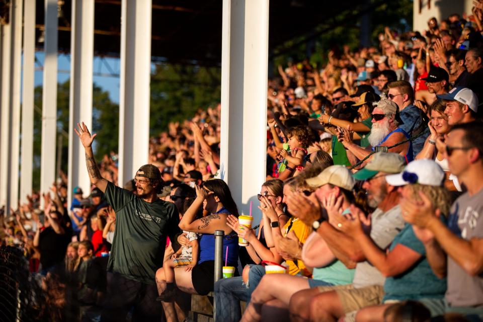 Spectators watch as monster trucks take the track during the grandstand event Wednesday, July 27, 2022, at the Ottawa County Fairgrounds. 